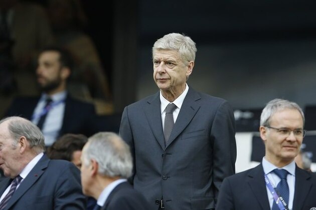 Arsenal coach Arsene Wenger takes his seat in the stands as he waits for the start of the Euro 2016 Group B soccer match between England and Russia, at the Velodrome stadium in Marseille, France, Saturday, June 11, 2016. (AP Photo/Kirsty Wigglesworth)