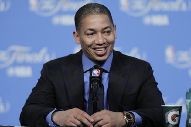 Cleveland Cavaliers coach Tyronn Lue smiles while talking with the media after Game 3 of basketball's NBA Finals in Cleveland, early Thursday, June 9, 2016. Cleveland defeated the Golden State Warriors 120-90. (AP Photo/Tony Dejak)