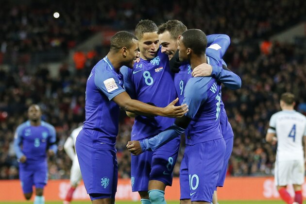 The Netherlands' Vincent Janssen, second right, celebrates scoring his side's first goal during the international friendly soccer match between The Netherlands and England at Wembley stadium in London, Tuesday, March 29, 2016. (AP Photo/Frank Augstein)