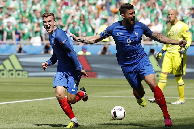 France's Antoine Griezmann, left, celebrates with his teammate Olivier Giroud after scoring his side's first goal, during the Euro 2016 round of 16 soccer match between France and Ireland, at the Grand Stade in Decines-­Charpieu, near Lyon, France, Sunday, June 26, 2016. (AP Photo/Laurent Cipriani)