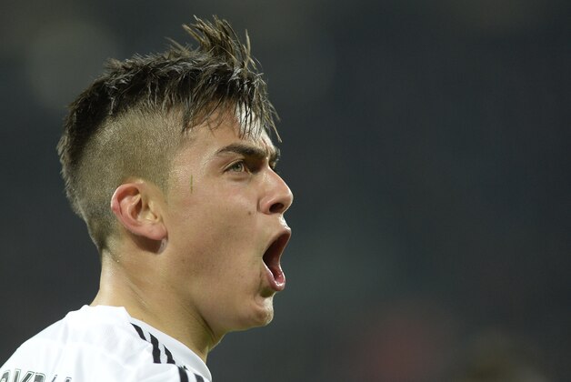 Juventus' Paulo Dybala celebrates after scoring during a Serie A soccer match between Juventus and Sassuolo at the Juventus stadium, in Turin, Italy, Friday, March 11, 2016. (AP Photo/Massimo Pinca)