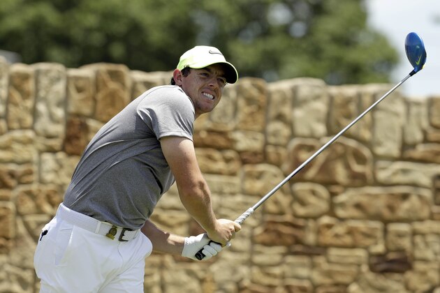 Rory McIlroy, of Northern Ireland, watches his tee shot on the ninth hole during the rain delayed second round of the U.S. Open golf championship at Oakmont Country Club on Saturday, June 18, 2016, in Oakmont, Pa. (AP Photo/Charlie Riedel)