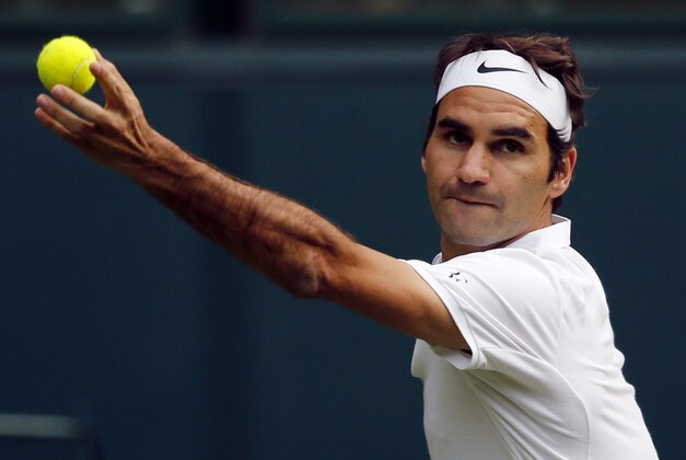 Roger Federer of Switzerland serves to Guido Pella of Argentina during their men's singles match on day one of the Wimbledon Tennis Championships in London, Monday, June 27, 2016. (AP Photo/Alastair Grant)