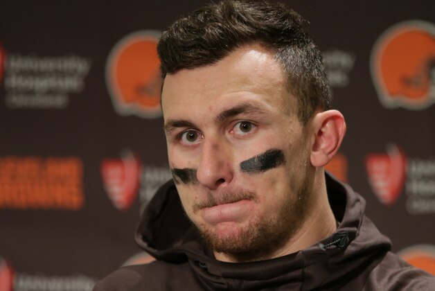 FILE - In this Dec. 20, 2015, file photo, Cleveland Browns quarterback Johnny Manziel speaks with media members following the team's 30-13 loss to the Seattle Seahawks in an NFL football game, in Seattle. Manziel has been suspended for the first four games of next season for violating the NFL's substance-abuse policy.The suspension announced Thursday, June 30, 2016, is not related to the NFL's domestic violence policy, but the free agent quarterback would be subject to it if he signs with another team. (AP Photo/Scott Eklund, File)