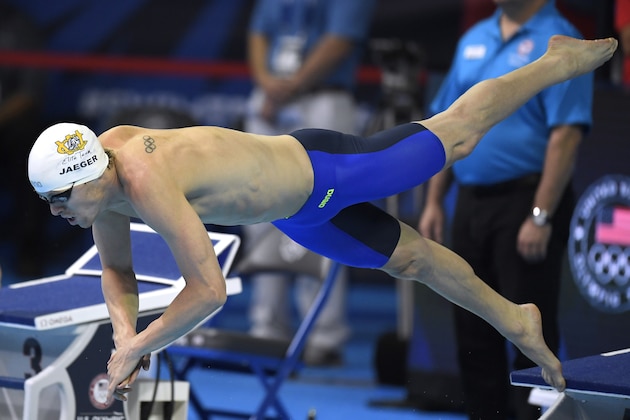 Connor Jaeger dives at the start of his heat in the men's 1500-meter freestyle preliminaries at the U.S. Olympic swimming trials, Saturday, July 2, 2016, in Omaha, Neb. (AP Photo/Mark J. Terrill)
