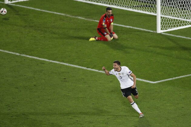 Germany's Jonas Hector celebrates after scoring the decisive penalty during the Euro 2016 quarterfinal soccer match between Germany and Italy, at the Nouveau Stade in Bordeaux, France, Saturday, July 2, 2016. Germany beat Italy 6-5 in a penalty shootout. (AP Photo/Michael Sohn)