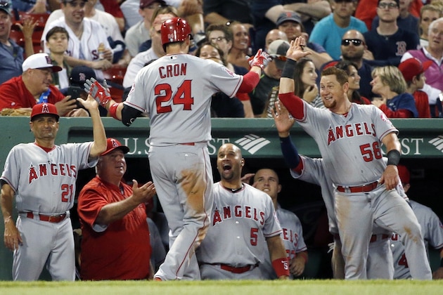 Los Angeles Angels' C.J. Cron (24) celebrates his two-run home run during the seventh inning of a baseball game against the Boston Red Sox in Boston, Saturday, July 2, 2016. (AP Photo/Michael Dwyer)