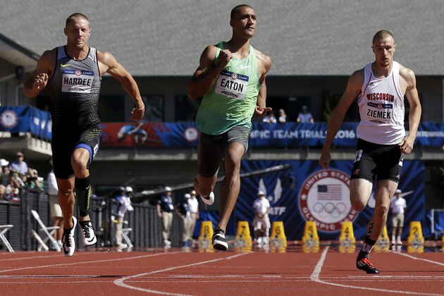 Ashton Eaton, center, wins his heat, followed by Trey Hardee in second place, left, and Zach Ziemek, in third place during the decathlon 100-meter run at the U.S. Olympic Track and Field Trials, Saturday, July 2, 2016, in Eugene Ore. (AP Photo/Marcio Jose Sanchez)