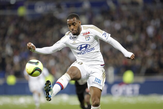 Lyon's Alexandre Lacazette controls the ball during their French League One soccer match against Nice in Decines, near Lyon, central France, Friday, April 15, 2016. (AP Photo/Laurent Cipriani)