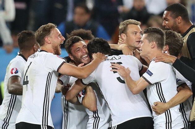 Germany players celebrate after winning  the Euro 2016 quarterfinal soccer match between Germany and Italy, at the Nouveau Stade in Bordeaux, France, Saturday, July 2, 2016. (AP Photo/Thanassis Stavrakis)