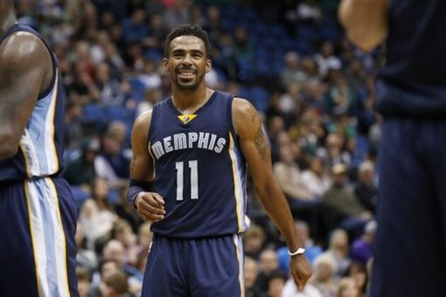 FILE - In this Nov. 15, 2015, file photo, Memphis Grizzlies guard Mike Conley (11) smiles during the second half of an NBA basketball game against the Minnesota Timberwolves in Minneapolis. The NBA announced Saturday, April 23, 2016, that Conley is the winner of the Joe Dumars Trophy for sportsmanship. The annual award for ethical behavior and fair play is named for former Detroit Pistons guard and Hall of Famer Joe Dumars.   (AP Photo/Ann Heisenfelt, File)