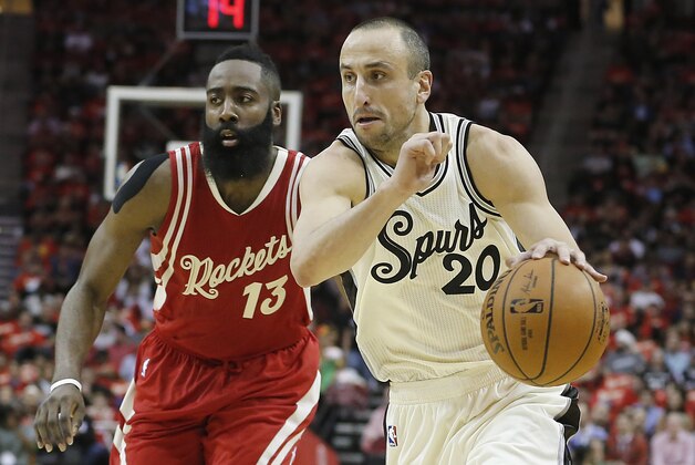 Dec 25, 2015; Houston, TX, USA; San Antonio Spurs guard Manu Ginobili (20) dribbles against the Houston Rockets guard James Harden (13) in the first half of a NBA basketball game on Christmas at Toyota Center. Mandatory Credit: Thomas B. Shea-USA TODAY Sports