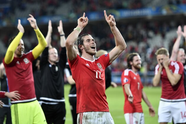 Wales' Gareth Bale celebrates at the end of the Euro 2016 quarterfinal soccer match between Wales and Belgium, at the Pierre Mauroy stadium in Villeneuve d’Ascq, near Lille, France, Friday, July 1, 2016. Wales won 3-1. (AP Photo/Martin Meissner)