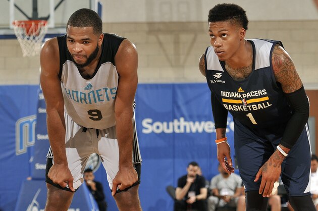 ORLANDO, FL - JULY 3: Aaron Harrison #9 of Charlotte Hornets and Joe Young #1 of Indiana Pacers look on during the game during the 2016 NBA Orlando Summer League on July 3, 2016 at Amway Center in Orlando, Florida. NOTE TO USER: User expressly acknowledges and agrees that, by downloading and or using this photograph, User is consenting to the terms and conditions of the Getty Images License Agreement. Mandatory Copyright Notice: Copyright 2016 NBAE  (Photo by Fernando Medina/NBAE via Getty Images)