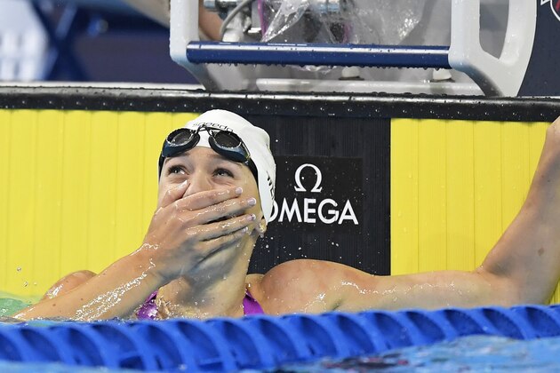 Abbey Weitzeil reacts after winning the women's 100-meter freestyle final at the U.S. Olympic swimming trials, Friday, July 1, 2016, in Omaha, Neb. (AP Photo/Mark J. Terrill)