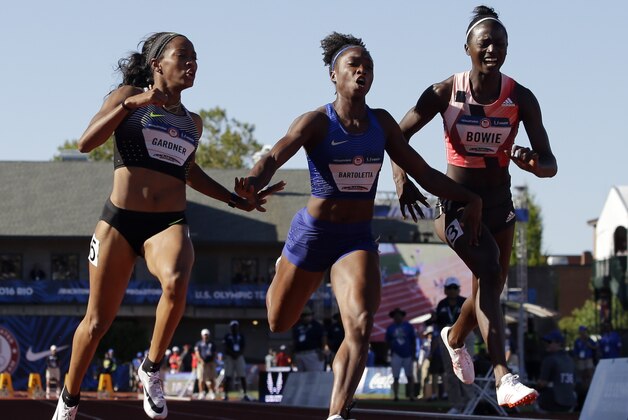 English Gardner, winner, from left, second place, Tianna Bartoletta, and third place, Tori Bowie finish the women's 100-meter final at the U.S. Olympic Track and Field Trials, Sunday, July 3, 2016, in Eugene Ore. (AP Photo/Marcio Jose Sanchez)