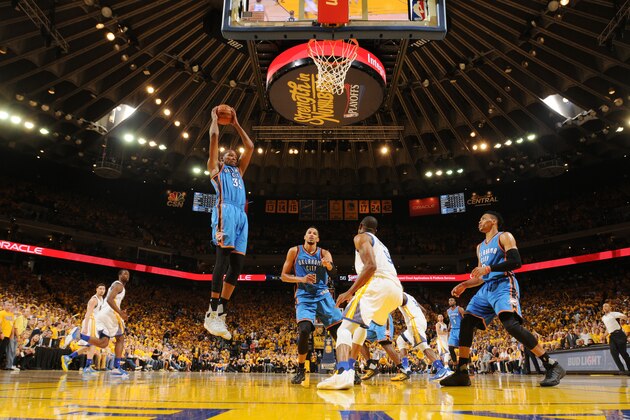 OAKLAND, CA - MAY 30:  Kevin Durant #35 of the Oklahoma City Thunder grabs the rebound against the Golden State Warriors in Game Seven of the Western Conference Finals during the 2016 NBA Playoffs on May 30, 2016 at ORACLE Arena in Oakland, California. NOTE TO USER: User expressly acknowledges and agrees that, by downloading and or using this photograph, user is consenting to the terms and conditions of Getty Images License Agreement. Mandatory Copyright Notice: Copyright 2016 NBAE (Photo by Noah Graham/NBAE via Getty Images)