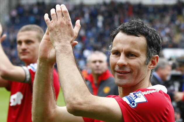 FILE - This is a Saturday May 14, 2011 file photo of Manchester United's Ryan Giggs,  celebrates after Manchester United won the English Premier League at Ewood Park, Blackburn, England. Ryan Giggs Friday July 1, 2016  ended his 29-year association with Manchester United, leaving the coaching staff at the fallen Premier League powers at the start of Jose Mourinho’s reign.  The 42-year-old Giggs joined United in 1987 as a 14-year-old went on to play a record 963 times for the first team, mostly under Alex Ferguson. (AP Photo/Tim Hales, File)
