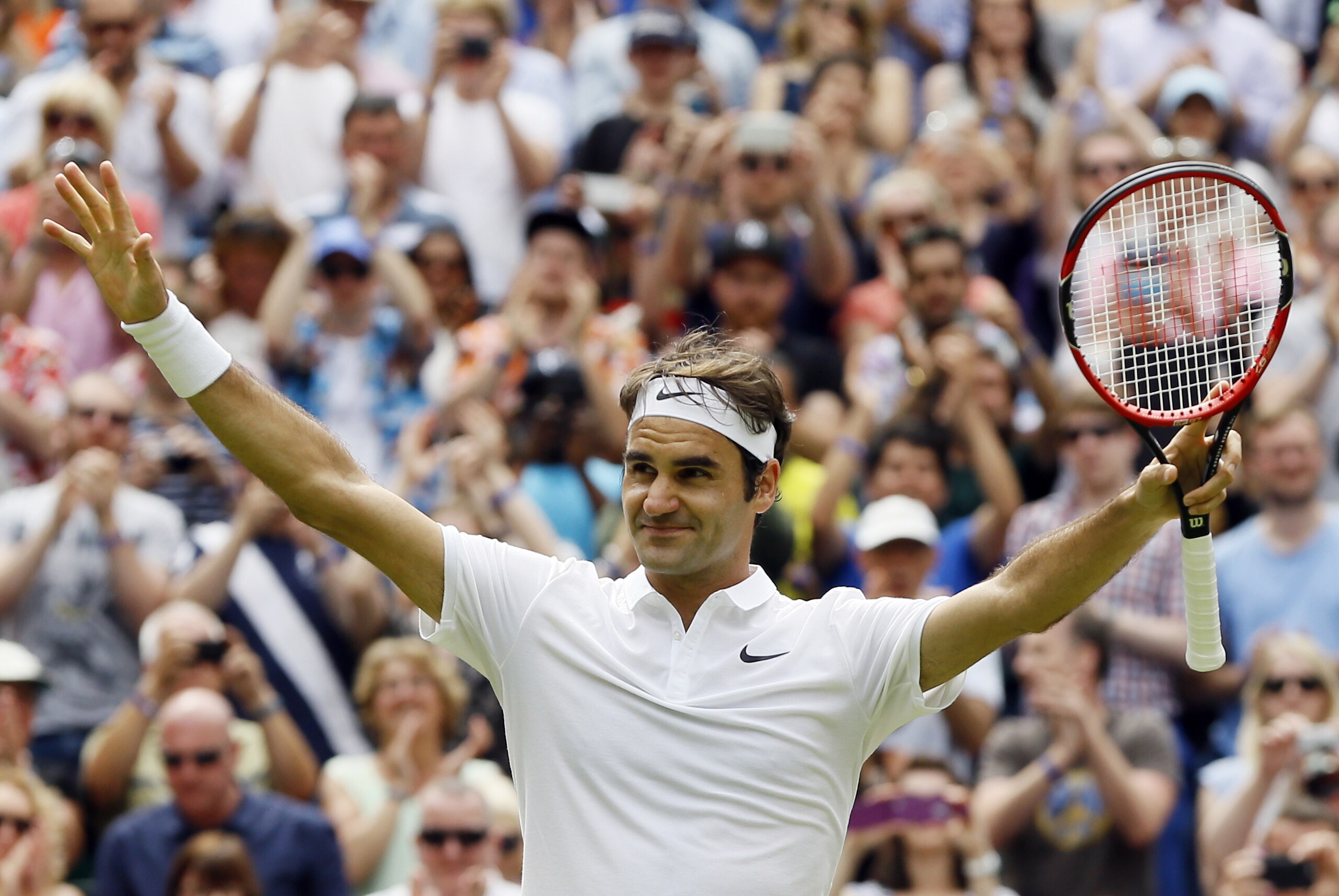 Roger Federer of Switzerland celebrates after beating Steve Johnson of the U.S in their men's singles match on day eight of the Wimbledon Tennis Championships in London, Monday, July 4, 2016. (AP Photo/Kirsty Wigglesworth)