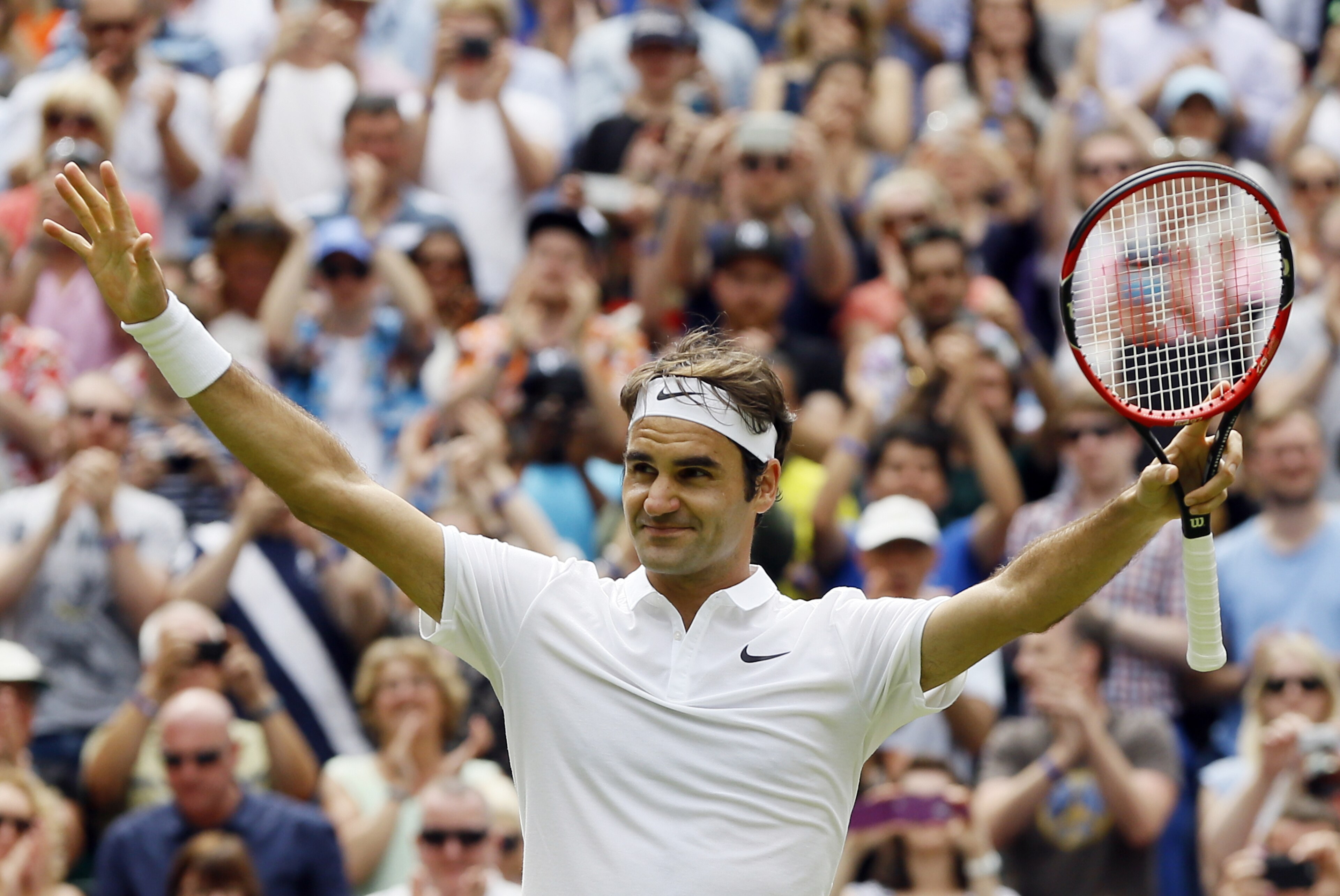 Roger Federer of Switzerland celebrates after beating Steve Johnson of the U.S in their men's singles match on day eight of the Wimbledon Tennis Championships in London, Monday, July 4, 2016. (AP Photo/Kirsty Wigglesworth)