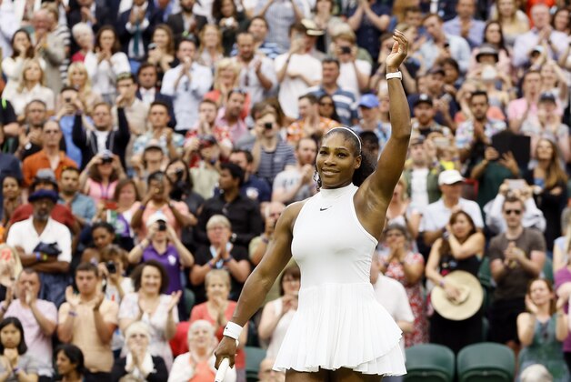 Serena Williams of the U.S celebrates after beating Svetlana Kuznetsova of Russia in their women's singles match on day eight of the Wimbledon Tennis Championships in London, Monday, July 4, 2016. (AP Photo/Kirsty Wigglesworth)