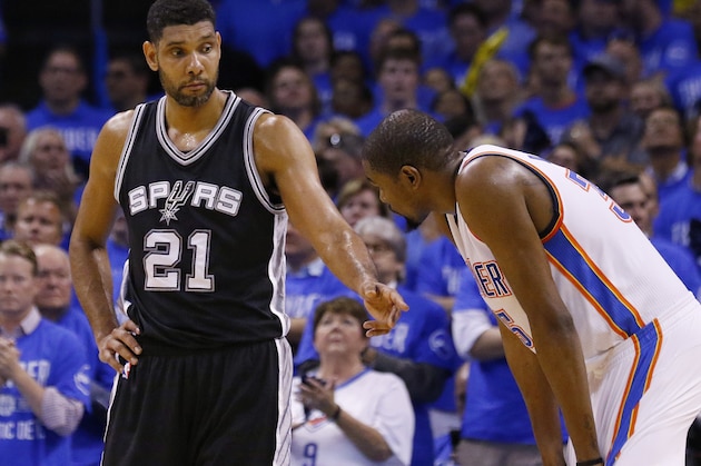 San Antonio Spurs center Tim Duncan (21) talks with Oklahoma City Thunder forward Kevin Durant, right, during the fourth quarter of Game 6 of a second-round NBA basketball playoff series in Oklahoma City, Thursday, May 12, 2016. Oklahoma City won 113-99 and moves on to the Western Conference finals. (AP Photo/Alonzo Adams)