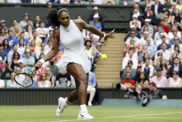 Serena Williams of the U.S returns to Svetlana Kuznetsova of Russia during their women's singles match on day eight of the Wimbledon Tennis Championships in London, Monday, July 4, 2016. (AP Photo/Kirsty Wigglesworth)
