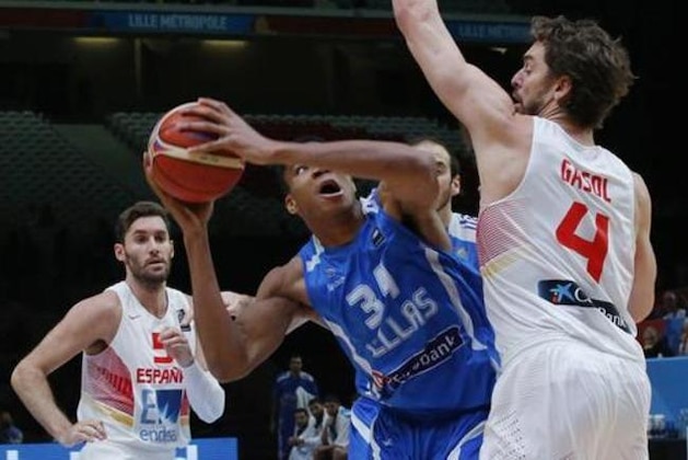 FILE - In this Sept. 15, 2015, file photo, Greece's Giannis Antetokounmpo looks to shoot as Spain's Pau Gasol, right, defends during a EuroBasket European Basketball Championship quarterfinal in Lille, northern France. Antetokounmpo will try to help Greece earn a spot in the Olympics when it plays in next week’s Olympic Qualifying Tournament in Milan, Italy. (AP Photo/Michel Euler, File)