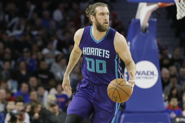 Charlotte Hornets forward Spencer Hawes brings the ball up court during the second half of an NBA basketball game against the Detroit Pistons, Friday, March 25, 2016, in Auburn Hills, Mich. (AP Photo/Carlos Osorio)