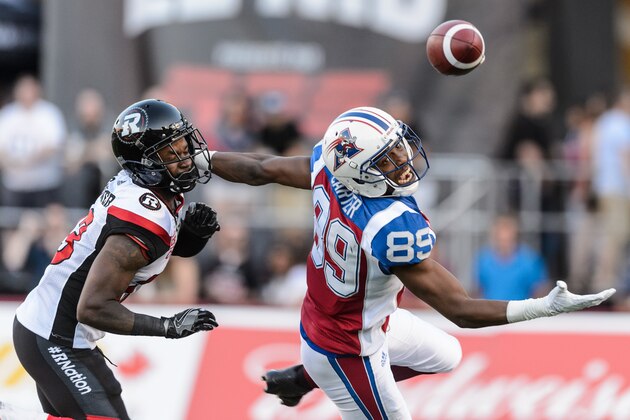 MONTREAL, QC - JUNE 30: Wide receiver Duron Carter #89 of the Montreal Alouettes misses a pass with defensive back Forrest Hightower #23 of the Ottawa Redblacks close behind during the CFL game at Percival Molson Stadium on June 30, 2016 in Montreal, Quebec, Canada. (Photo by Minas Panagiotakis/Getty Images)