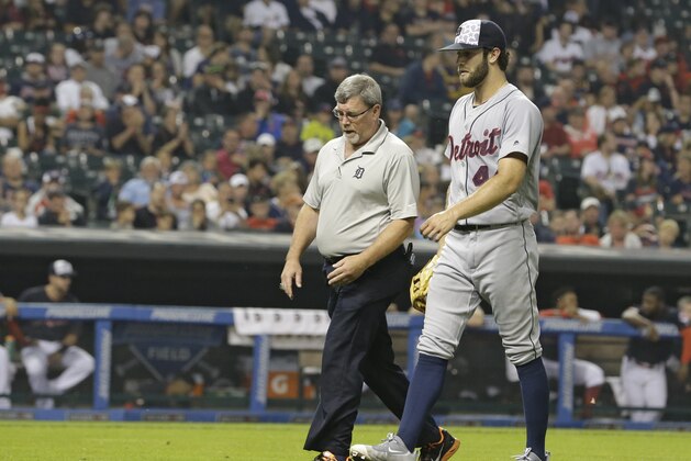Detroit Tigers starting pitcher Daniel Norris, right, walks off the field in the third inning of a baseball game against the Cleveland Indians, Monday, July 4, 2016, in Cleveland. (AP Photo/Tony Dejak)