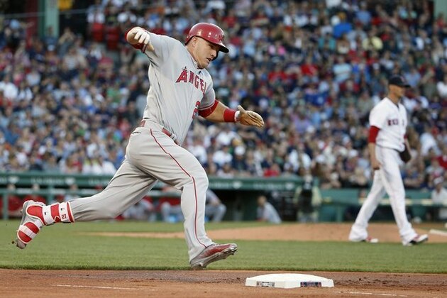 Los Angeles Angels' Mike Trout runs on his ground rule double off Boston Red Sox's Clay Buchholz, right, during the first inning of a baseball game in Boston, Saturday, July 2, 2016. (AP Photo/Michael Dwyer)