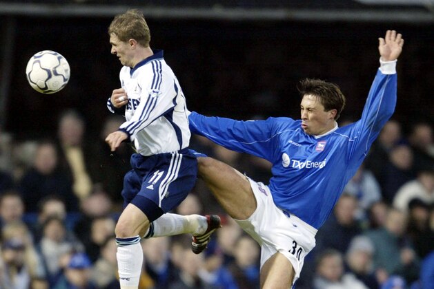 12 Jan 2002:  Martijn Reuser of Ipswich  challenges Sergei Rebrov of Tottenham during the FA Barclaycard Premership match between Ipswich Town and Tottenham Hotspur at Portman Road, Ipswich. DIGITAL IMAGE Mandatory Credit: David Cannon/Getty Images