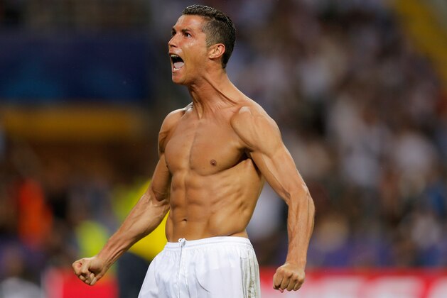Real Madrid's Cristiano Ronaldo celebrates after scoring the winning penalty shot during the Champions League final soccer match between Real Madrid and Atletico Madrid at the San Siro stadium in Milan, Italy, Saturday, May 28, 2016. Real Madrid won 5-3 on penalties after the match ended 1-1 after extra time. (AP Photo/Manu Fernandez) Real Madrid's Cristiano Ronaldo celebrates after scoring the winning penalty shot during the Champions League final soccer match between Real Madrid and Atletico Madrid at the San Siro stadium in Milan, Italy, Saturday, May 28, 2016. Real Madrid won 5-3 on penalties after the match ended 1-1 after extra time. (AP Photo/Manu Fernandez)