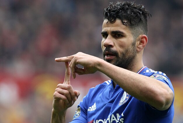 Chelsea's Brazilian-born Spanish striker Diego Costa celebrates scoring his team's first goal during the English Premier League football match between Sunderland and Chelsea at the Stadium of Light in Sunderland, northeast England on May 7, 2016. / AFP / LINDSEY PARNABY / RESTRICTED TO EDITORIAL USE. No use with unauthorized audio, video, data, fixture lists, club/league logos or 'live' services. Online in-match use limited to 75 images, no video emulation. No use in betting, games or single club/league/player publications.  /         (Photo credit should read LINDSEY PARNABY/AFP/Getty Images)