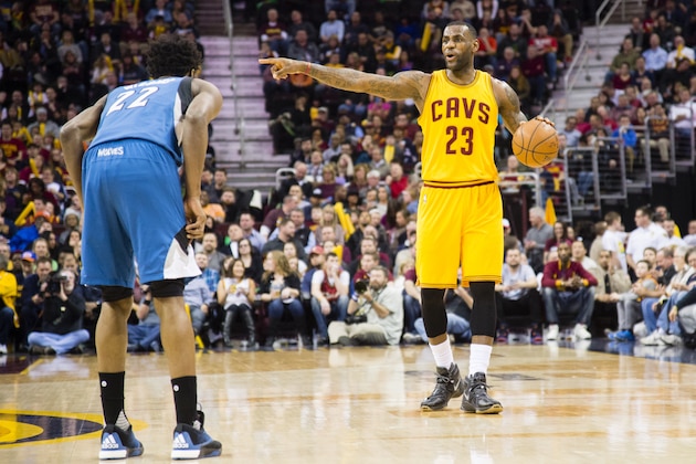 CLEVELAND, OH - JANUARY 25: Andrew Wiggins #22 of the Minnesota Timberwolves guards on LeBron James #23 of the Cleveland Cavaliers as James yells to his team during the first half at Quicken Loans Arena on January 25, 2016 in Cleveland, Ohio. NOTE TO USER: User expressly acknowledges and agrees that, by downloading and/or using this photograph, user is consenting to the terms and conditions of the Getty Images License Agreement. Mandatory copyright notice. (Photo by Jason Miller/Getty Images)