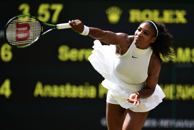 US player Serena Williams serves against Russia's Anastasia Pavlyuchenkova during their women's singles quarter-final match on the ninth day of the 2016 Wimbledon Championships at The All England Lawn Tennis Club in Wimbledon, southwest London, on July 5, 2016. / AFP / GLYN KIRK / RESTRICTED TO EDITORIAL USE        (Photo credit should read GLYN KIRK/AFP/Getty Images)