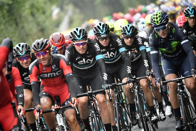 Great Britain's Christopher Froome (3rdR) rides behind his teammate Great Britain's Luke Rowe (4thR) during the 183 km second stage of the 103rd edition of the Tour de France cycling race on July 3, 2016 between Saint-Lo and Cherbourg-en-Cotentin, Normandy. / AFP / jeff pachoud        (Photo credit should read JEFF PACHOUD/AFP/Getty Images)