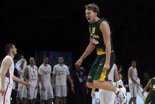 Lithuania's Mindaugas Kuzminskas celebrates his team's 67-64 win against Serbia after the semifinal match at the EuroBasket European Basketball Championships, in Lille, northern France, Friday, Sept. 18, 2015. (AP Photo/Michel Spingler)