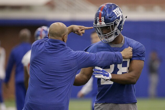 New York Giants secondary coach Tim Walton, left, gives instruction to cornerback Eli Apple (28) during NFL football rookie camp, Friday, May 6, 2016, in, East Rutherford, N.J. (AP Photo/Julie Jacobson)