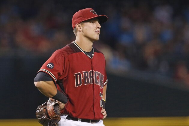 Arizona Diamondbacks' Jake Lamb pauses on the field after getting an error on a grounder hit by Philadelphia Phillies' Odubel Herrera during the eighth inning of a baseball game Wednesday, June 29, 2016, in Phoenix. (AP Photo/Ross D. Franklin)