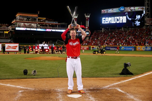 CINCINNATI, OH - JULY 13:  National League All-Star Todd Frazier #21 of the Cincinnati Reds celebrates with the trophy after winning the Gillette Home Run Derby presented by Head & Shoulders at the Great American Ball Park on July 13, 2015 in Cincinnati, Ohio.  (Photo by Elsa/Getty Images)
