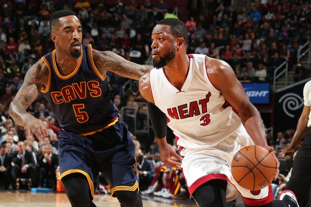 CLEVELAND, OH - APRIL 2: Dwyane Wade #3 of the Miami Heat drives against J.R. Smith #5 of the Cleveland Cavaliers during the game on April 2, 2015 at Quicken Loans Arena in Cleveland, Ohio. NOTE TO USER: User expressly acknowledges and agrees that, by downloading and/or using this photograph, User is consenting to the terms and conditions of the Getty Images License Agreement. Mandatory Copyright Notice: Copyright 2015 NBAE (Photo by Joe Murphy/NBAE via Getty Images)