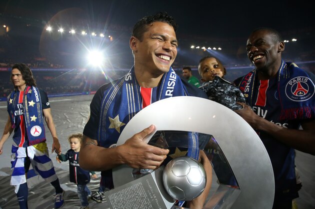 PARIS, FRANCE - MAY 14: Thiago Silva and Blaise Matuidi of PSG celebrate winning the French Ligue 1 championship following the French Ligue 1 match between Paris Saint-Germain (PSG) and FC Nantes at Parc des Princes stadium on May 14, 2016 in Paris, France. (Photo by Jean Catuffe/Getty Images)