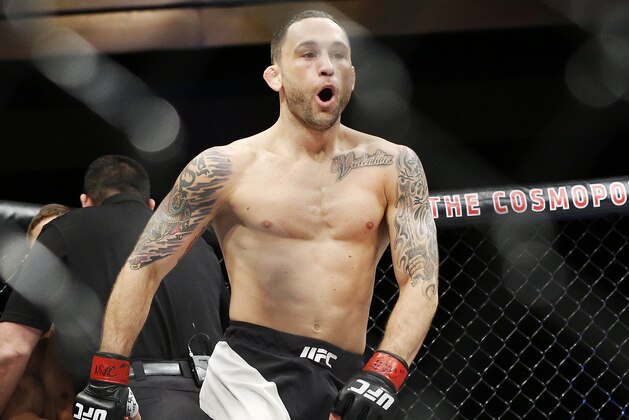 Frankie Edgar celebrates after defeating Chad Mendes in a featherweight bout during The Ultimate Fighter finale Friday, Dec. 11, 2015, in Las Vegas. (AP Photo/John Locher)