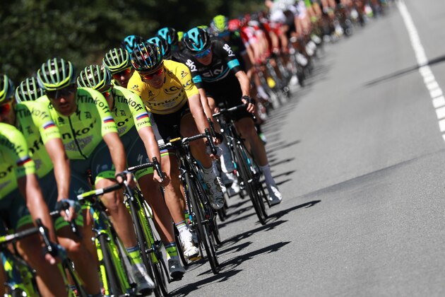 Slovakia's Peter Sagan (3rdL), wearing the overall leader's yellow jersey, rides in the pack behind his teammates of the Russia's Tinkoff cycling team during the 216 km fifth stage of the 103rd edition of the Tour de France cycling race on July 6, 2016 between Limoges and Le Lioran. / AFP / KENZO TRIBOUILLARD        (Photo credit should read KENZO TRIBOUILLARD/AFP/Getty Images)