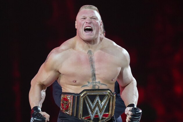 FILE - In this March 29, 2015, file photo, Brock Lesnar makes his entrance at Wrestlemania XXXI in Santa Clara, Calif. UFC 200 has grown so big that a single show can’t contain it. The mixed martial arts promotion is throwing an “International Fight Week” in Las Vegas with compelling shows on three consecutive nights, culminating in the star-studded pay-per-view event Saturday. Jon Jones meets light heavyweight champion Daniel Cormier in the main event of a card also featuring the return of former heavyweight champ Brock Lesnar. (AP Photo/Don Feria, File)