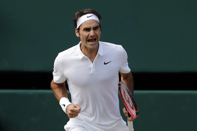 Roger Federer of Switzerland celebrates a point against Marin Cilic of Croatia during their men's singles match on day ten of the Wimbledon Tennis Championships in London, Wednesday, July 6, 2016. (AP Photo/Ben Curtis)