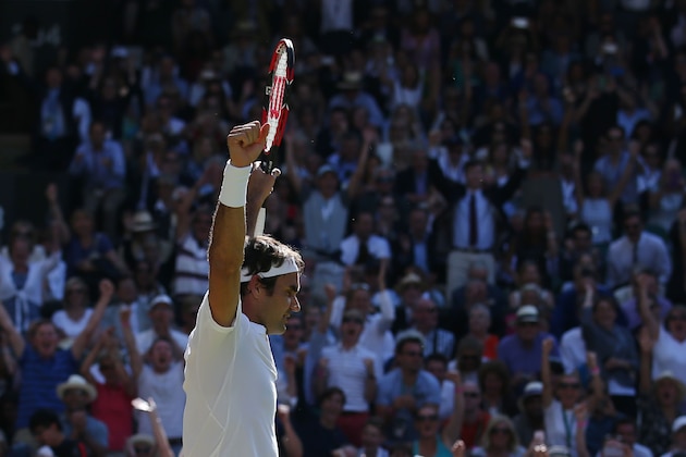 Switzerland's Roger Federer celebrates beating Croatia's Marin Cilic during their men's singles quarter-final match on the tenth day of the 2016 Wimbledon Championships at The All England Lawn Tennis Club in Wimbledon, southwest London, on July 6, 2016. / AFP / JUSTIN TALLIS / RESTRICTED TO EDITORIAL USE        (Photo credit should read JUSTIN TALLIS/AFP/Getty Images)