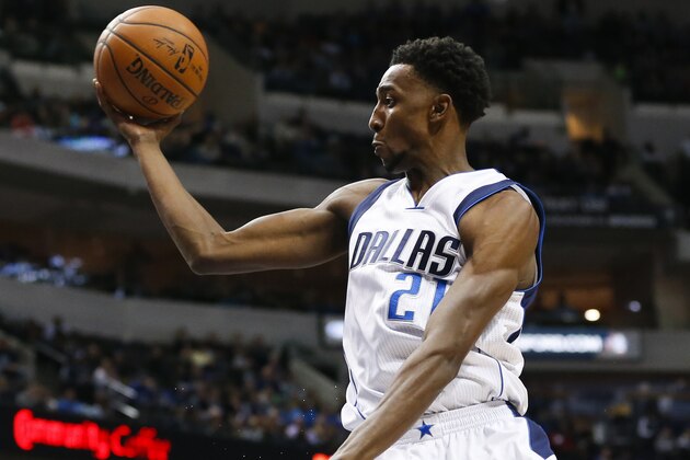 Dallas Mavericks forward Jeremy Evans (21) is fouled by Golden State Warriors center Marreese Speights during the second half an NBA basketball game Wednesday, Dec. 30, 2015, in Dallas. The Mavericks won 114-91. (AP Photo/Jim Cowsert)